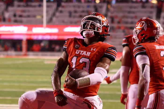 Utah Utes quarterback Nate Johnson (13) celebrates a touchdown against the Arizona Wildcats in the second quarter at Rice-Eccles Stadium.